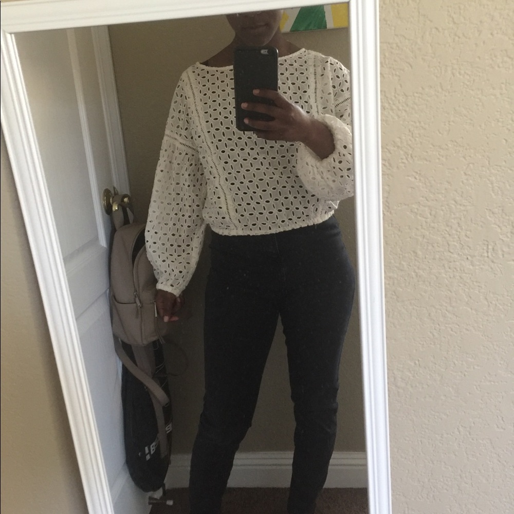A white cropped shirt and a beautiful hole pattern